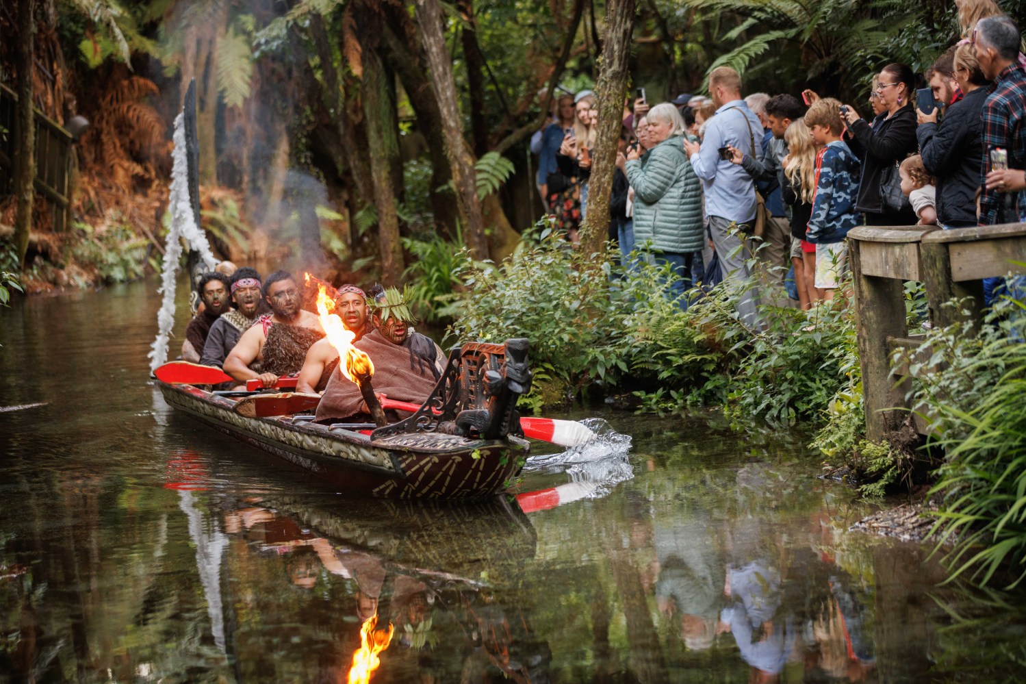 a group of people in a boat on a river